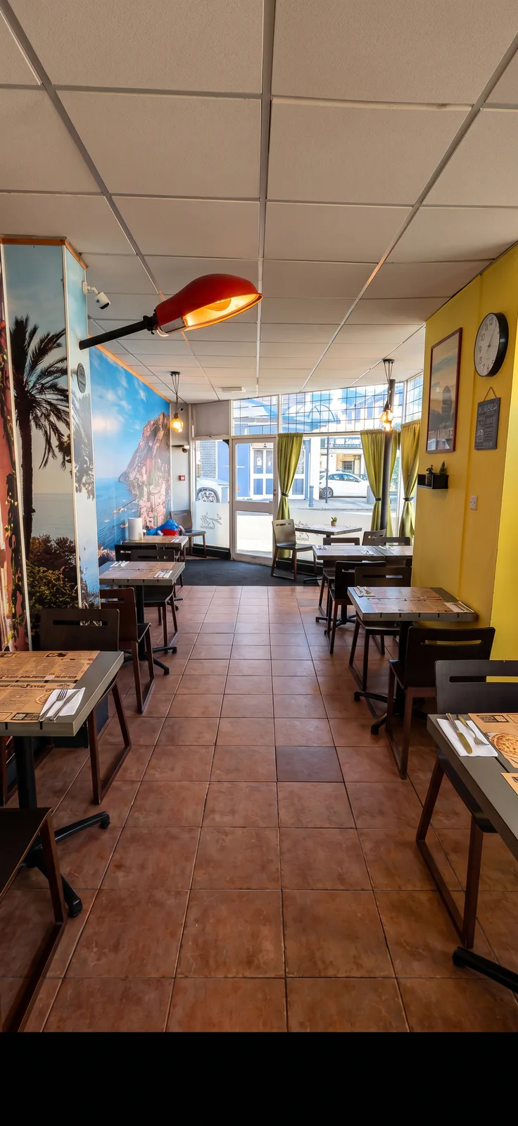 Basilico dining room seating and warm table lighting